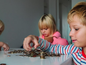 Illustrative picture with three kids counting money