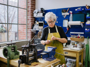 Art Jeweler Working in Studio 